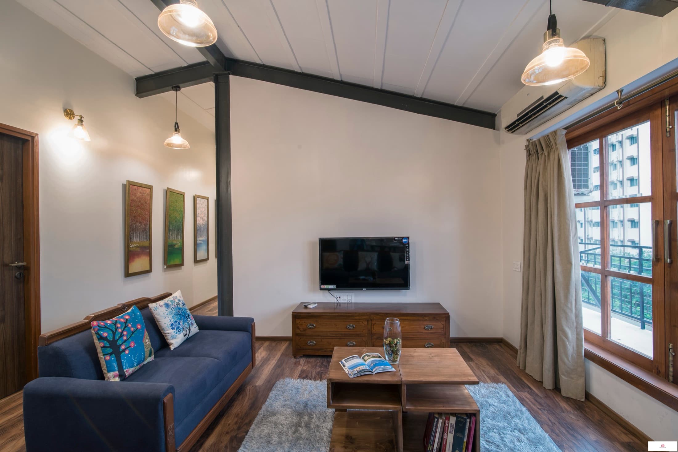 Living room with television and balcony doors