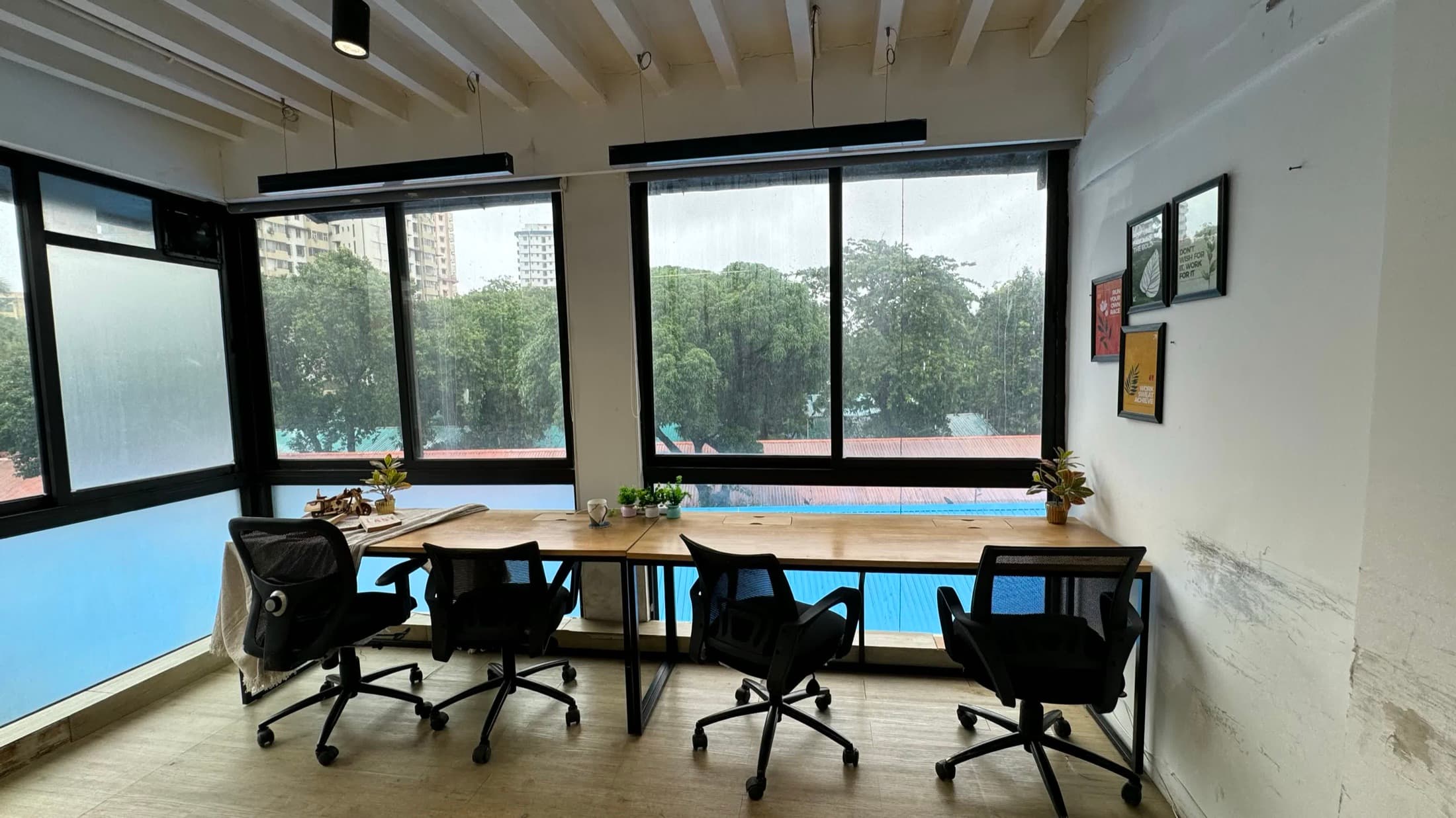 Window-facing shared workspace at Blue Co-Labs